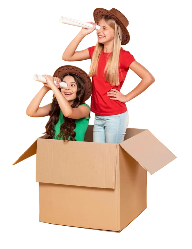 Girls playing in a cardboard box